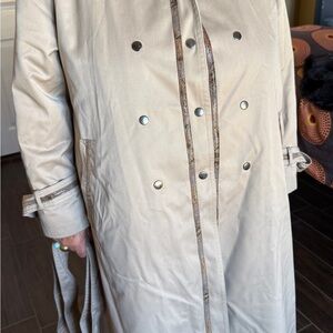 Elegant vintage beige women’s trench coat.